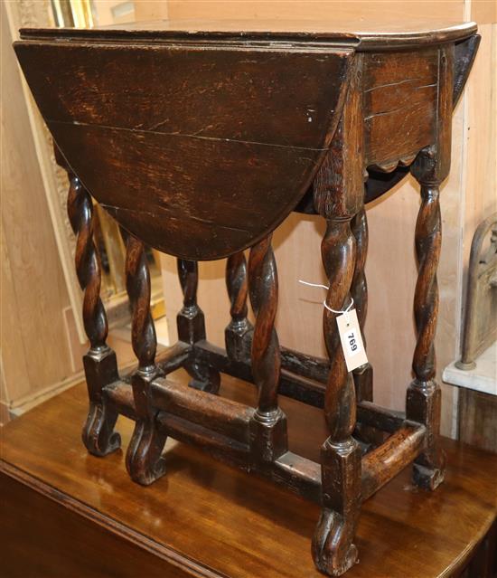 A Braganza style period oak side table W.64cm